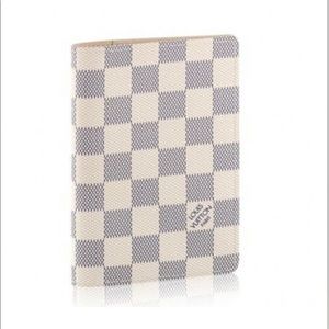 Louis Vutton passport holder, lightly used. Has “TML” initials on inside.